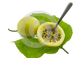 Ripe yellow passion fruits half cut isolated on white