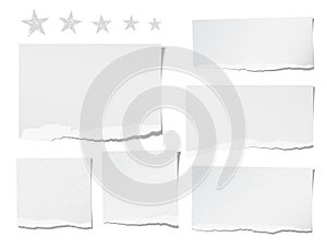 Ripped blank note, notebook, paper sheets for text or message stuck with stars stuck on white background.