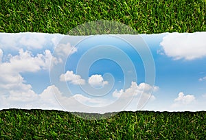 Ripped paper with blue sky on green grass