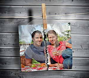 Ripped photo of couple hung with a peg