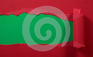 Ripped red paper with green background