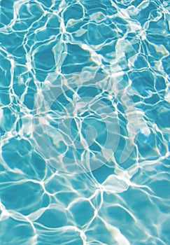 Ripped water in swimming pool. Surface of blue swimming pool, background of water.