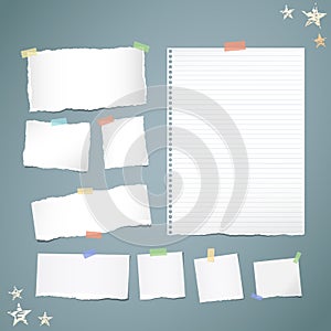 Ripped white note, notebook, copybook paper strips stuck with colorful sticky tape, stars on blue background.