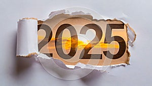 Ripped white paper revealling the year 2025 written in brown numbers on a orange background