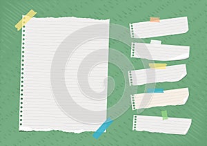 Ripped white ruled note, notebook, copybook paper sheets stuck on bright green lined pattern