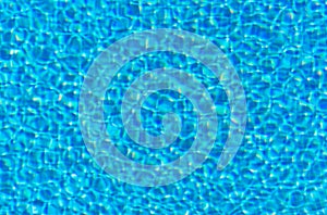 Rippled blue blurred swimming-pool water