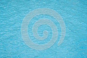 rippled pattern of clean water in a blue swimming pool