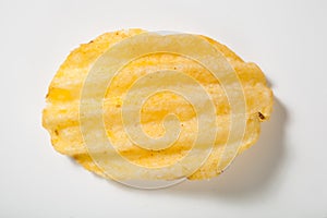 Rippled potato chip on white