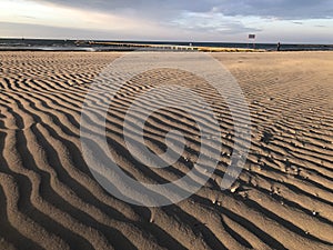 Rippled sand dunes in early morning light on Grado beach - Italy