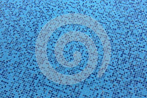 Ripples Distorting the Blue Tile Lining of a Pool