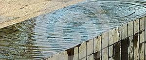 Ripples on horizontal water surface in a fountain photo