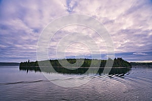 The ripples left by the cruise ship sailing across the lake. Tranquil beauty.