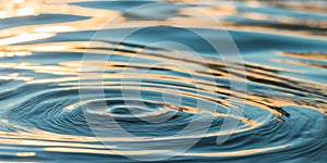 Rippling Water with Sunlight Reflections in Blue and Gold.