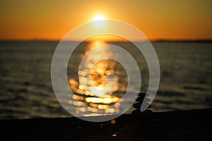 Riprap on beach at sunset 01