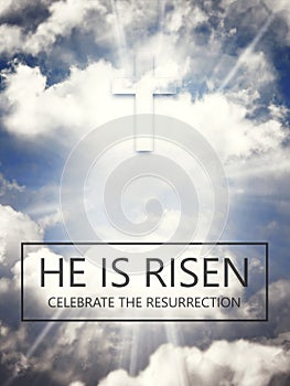 He is risen. Jesus Christ. Text over the sky with sun rays and fluffy clouds background