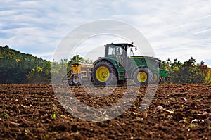 Rish, Bulgaria - Octomber 26th, 2015 Ploughing a field with John Deere 6930 tractor. John Deere 8100