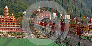 View of Ganga river embankment, Lakshman Jhula bridge and Tera Manzil Temple, Trimbakeshwar in Rishikesh