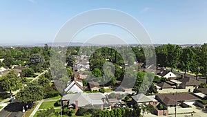 Rising aerial drone, over neighborhood of houses in Pasadena, CA