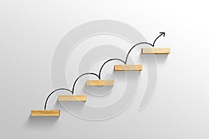 Rising arrow on staircase, increasing business