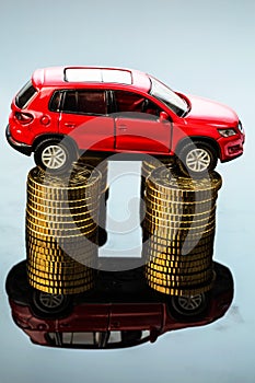 Rising car costs. car on coins