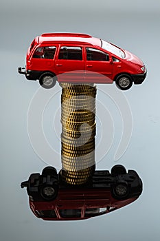 Rising car costs. car on coins