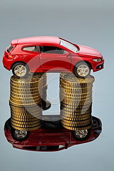 Rising car costs. car on coins