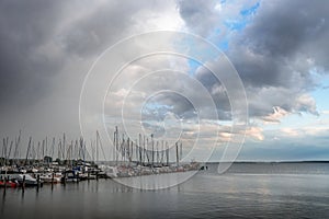 Rising clouds over the marina with sailboats in the tourist resort Rerik at the Baltic Sea in Mecklenburg-Western Pomerania,