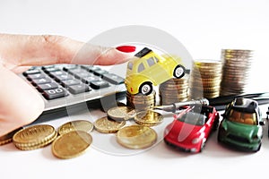 Rising cost for car running concept with miniature yellow car on stack of cash money