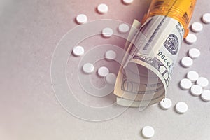 Rising cost of health care with spilled medicine. Drug abuse. Addiction.