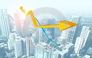 Rising graph and decreasing graph with city background photo