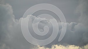 Rising large clouds of steam swirling against the sky in slow motion