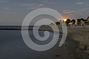 Rising moon at niendorf beach in luebeck