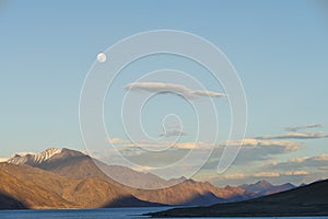 Rising moon over mountains