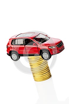 Rising motoring costs. car on coins