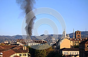 Rising smoke column in Turin