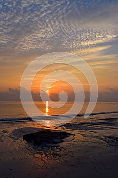 Rising Sun with Golden Reflection in Sea Water with Pattern of Clouds in Sky - Kalapathar Beach, Havelock Island, Andaman