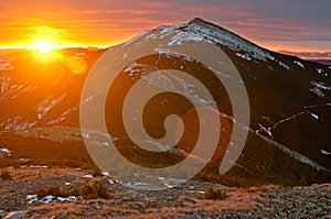 Rising sun in Gorgany mountains. Carpathians