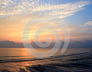Rising Sun at Horizon over in Sea Water with Pattern of Clouds in Colorful Sky - Kalapathar Beach, Havelock Island, Andaman
