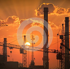 Rising sun over the industrial landscape