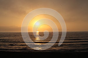 Rising sun over the Mediterranean sea. orange Cloudy dusk sky and rising sun over water. Beautiful sunshine, stunning sunrise, cal