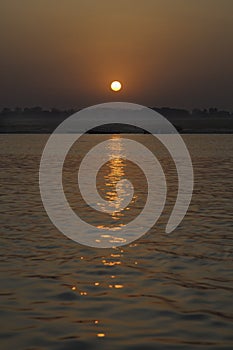 The Rising Sun Over the River Ganges