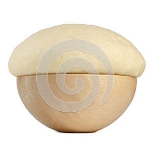 Rising Yeast Dough in Wooden Bowl