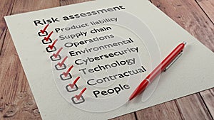 Risk assessment checklist with red pen and paper