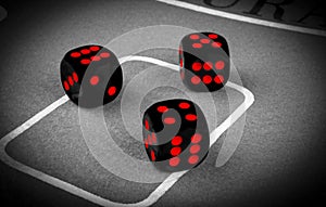 risk concept - playing dice on a green gaming table. Playing a game with dice. Red casino dice rolls. Rolling the dice concept
