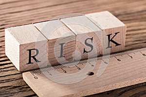 Risk Concept With Wooden Ruler