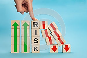 RISK cube blocks stop fall blocks protect against business crisis or risk protection concept. Hand The hand of a