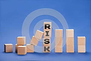 RISK cube blocks stop fall blocks protect against business crisis or risk protection concept. Stop the domino effect