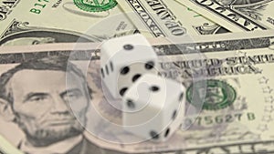 Risk factor on dollar investments dices on banknotes rotating