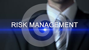Risk management, businessman in suit pressing button on screen, consultation
