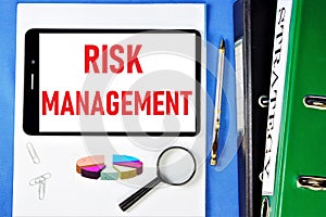 Risk management-lettering on a tablet PC. Analysis of the probability and consequences of adverse events, financial losses of